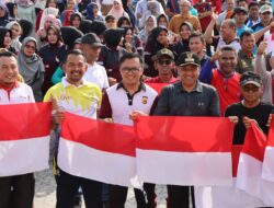 Kapolres Aceh Timur Dampingi Pj. Bupati Launching Gerakan 10 Juta Bendera Merah Putih